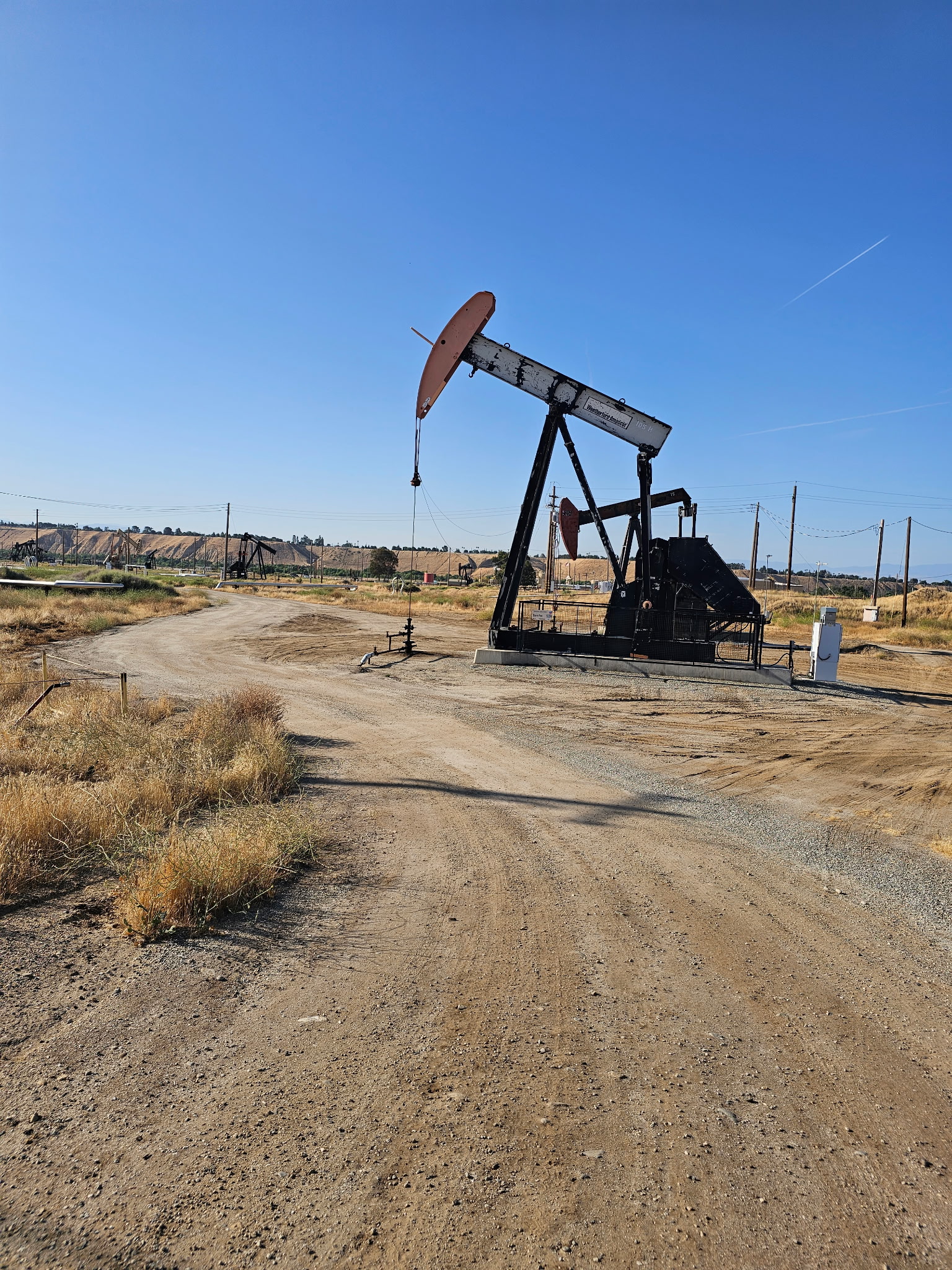 Oil Pumpjack on Dirt Road