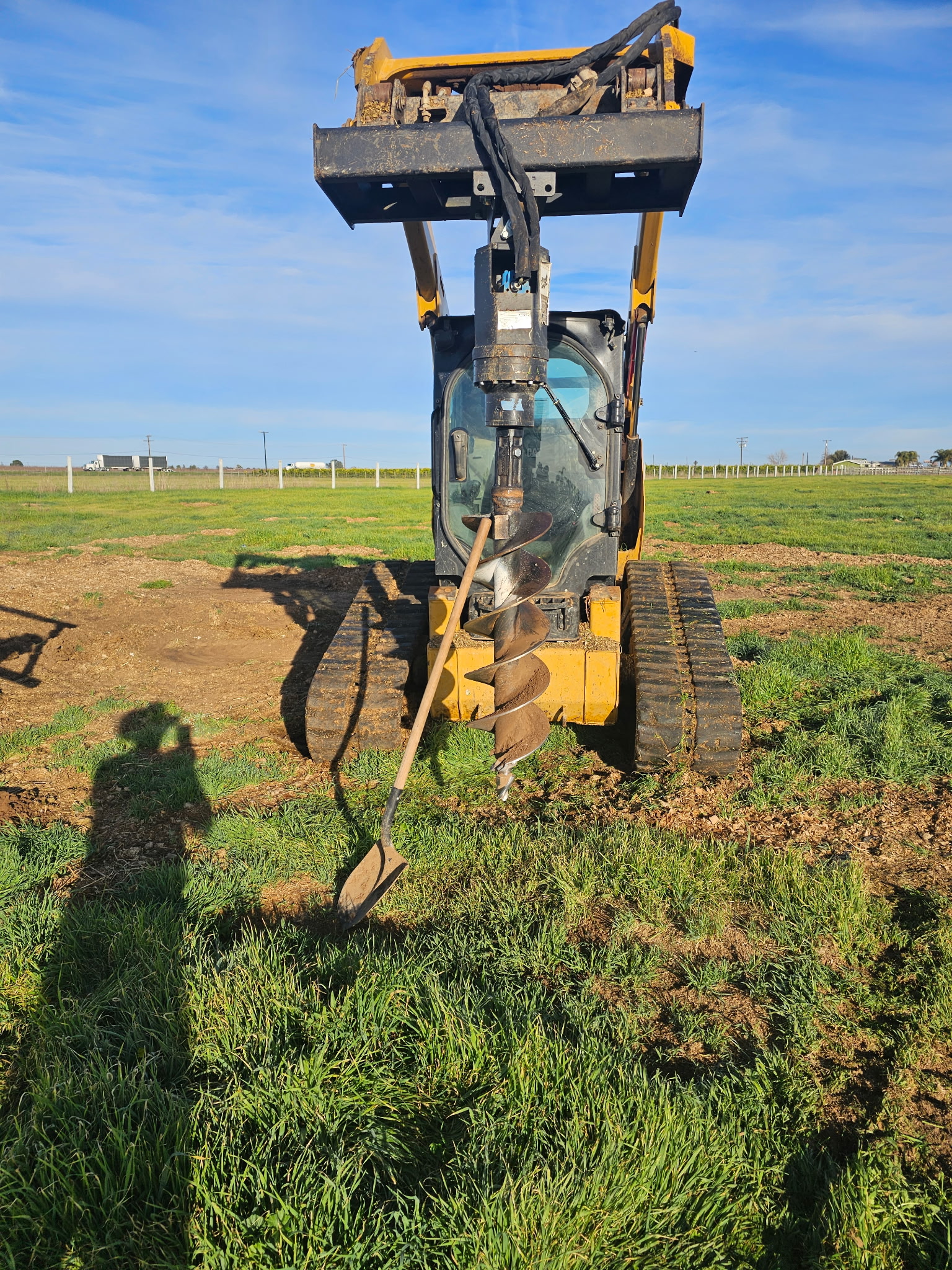 Skid Steer with Auger Attachment